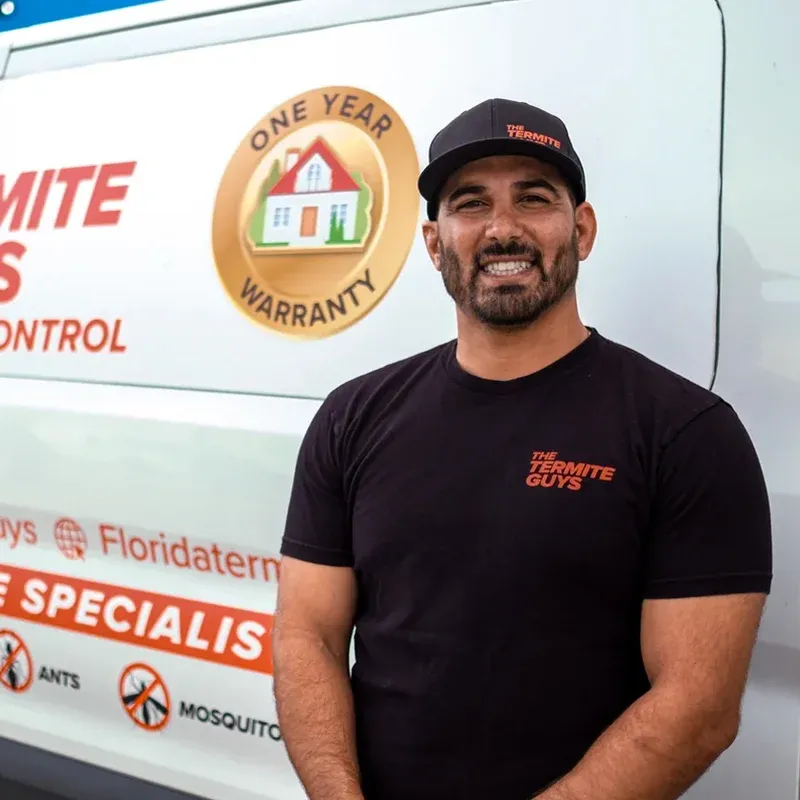 Florida Termite Guys technician performing termite treatment at a South Miami home