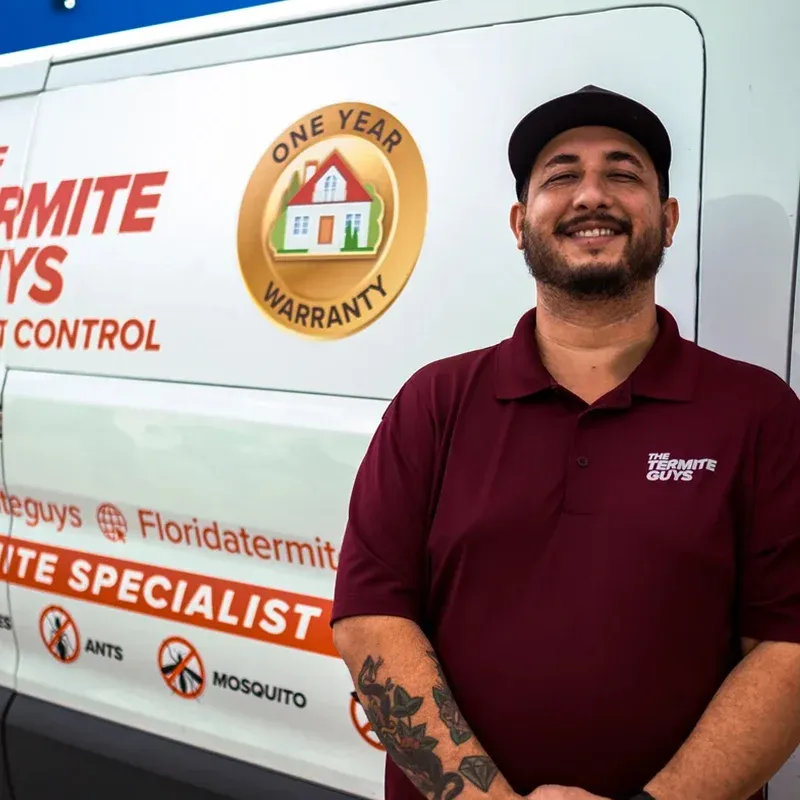 Florida Termite Guys technician applying termite treatment at Coral Gables home