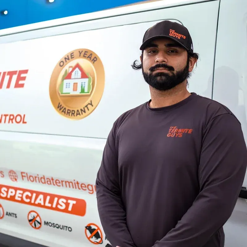 Florida Termite Guys technician providing termite treatment service at a Pinecrest estate
