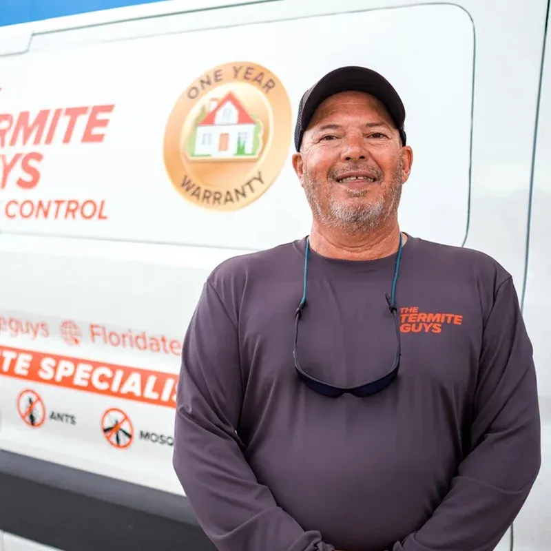 Florida Termite Guys technician inspecting for subterranean termite mud tubes