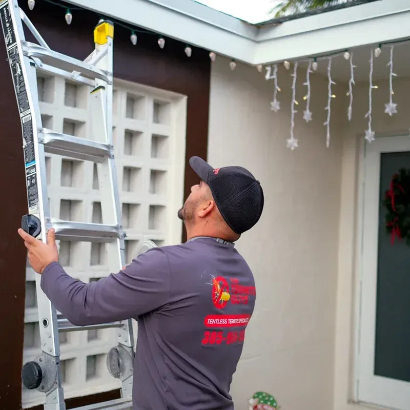Professional termite inspector arriving at residential property in South Florida