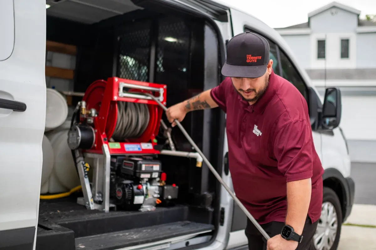 Professional termite spray treatment equipment used by licensed technicians