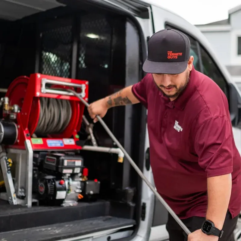 Licensed termite inspector examining Coral Gables property