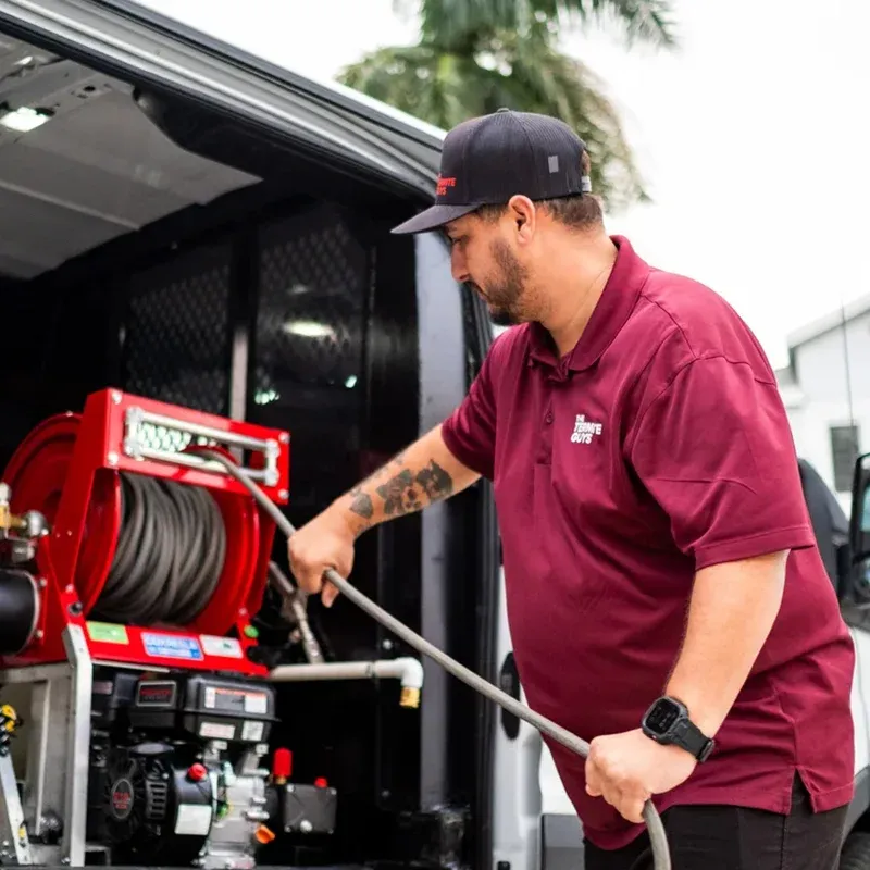 Florida Termite Guys technician performing no-tent termite treatment on a South Florida home