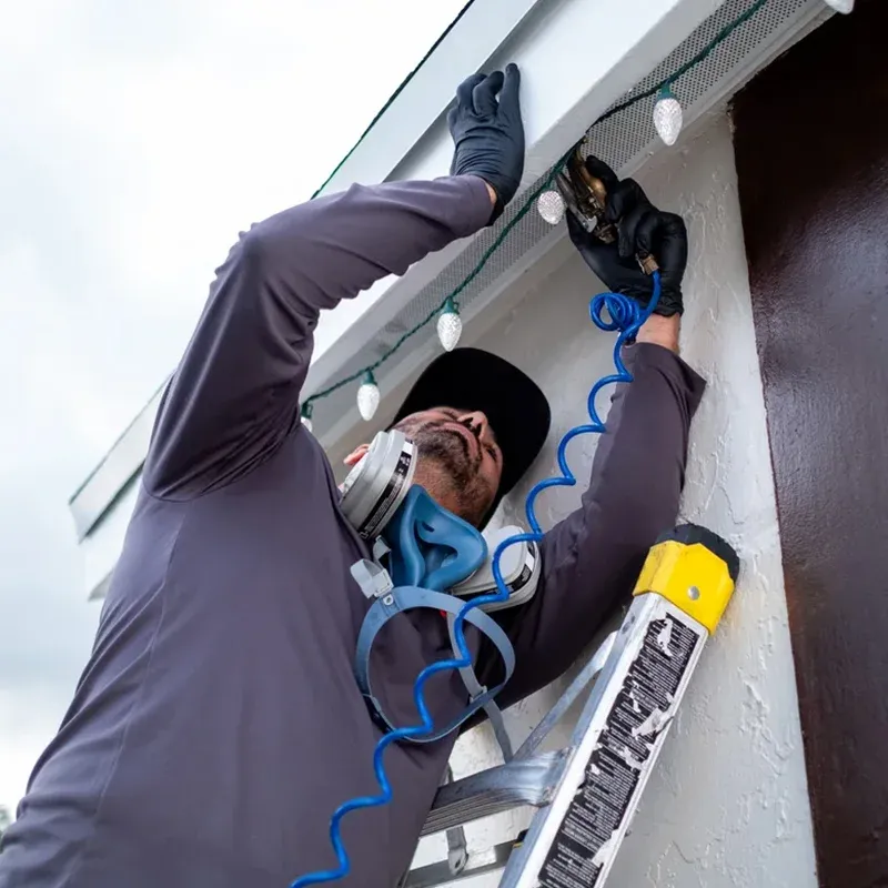 Florida Termite Guys technician treating a Hialeah property