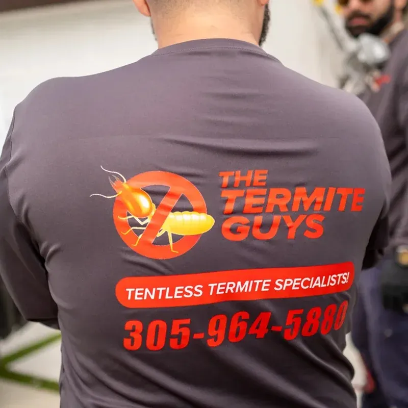 Florida Termite Guys technician providing termite treatment service at a Fontainebleau home