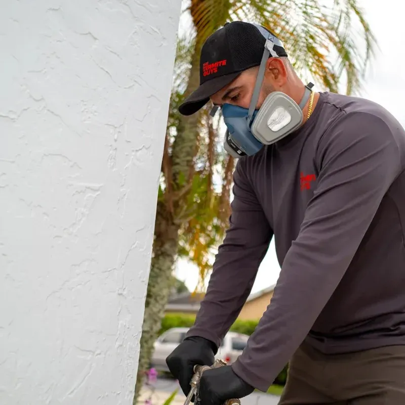 Licensed inspector conducting termite inspection at Miami Gardens property