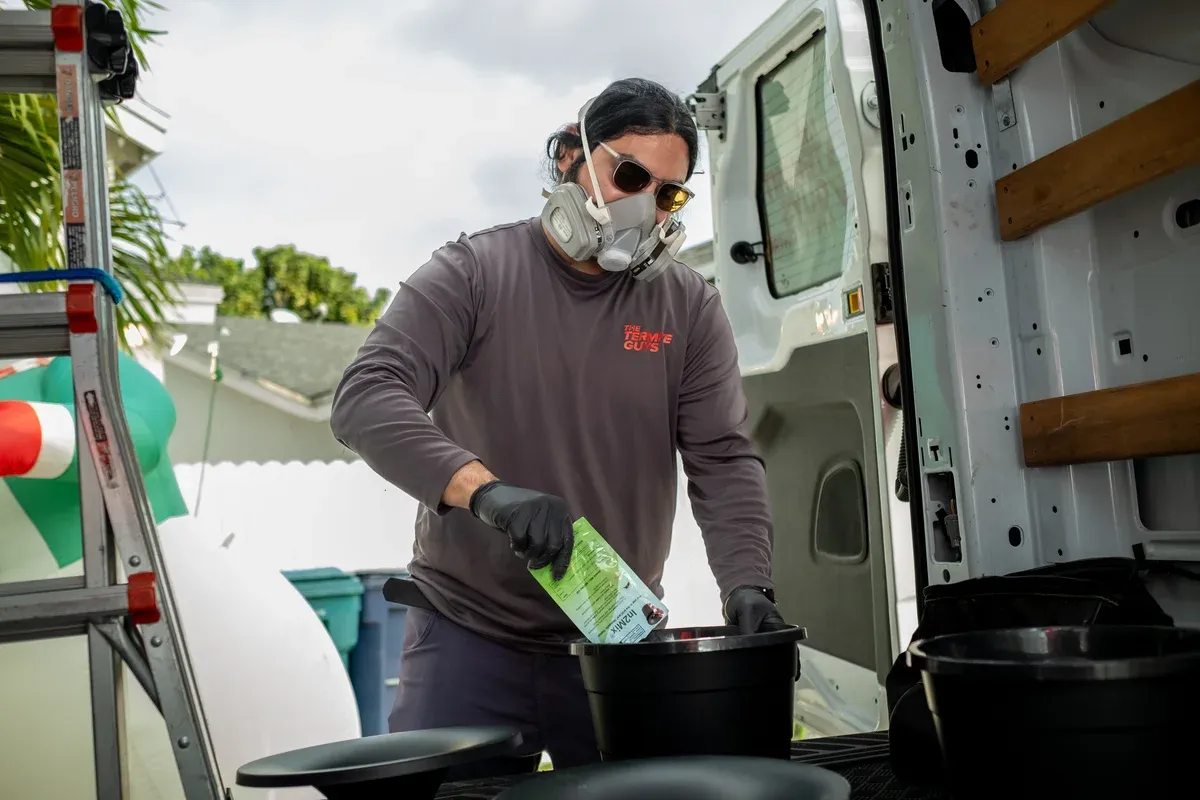 Professional fumigation team preparing Coconut Grove property for tenting